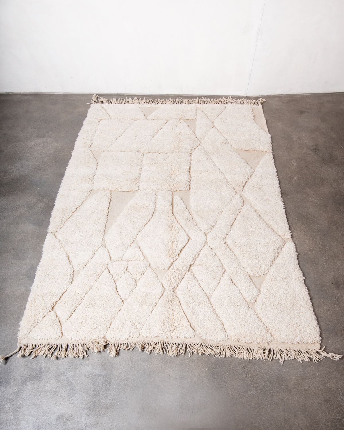 Modern, designer, handcrafted Berber rug from Morocco. Beniourain carpet with minimalist design, natural wool pile and a fluffy texture.